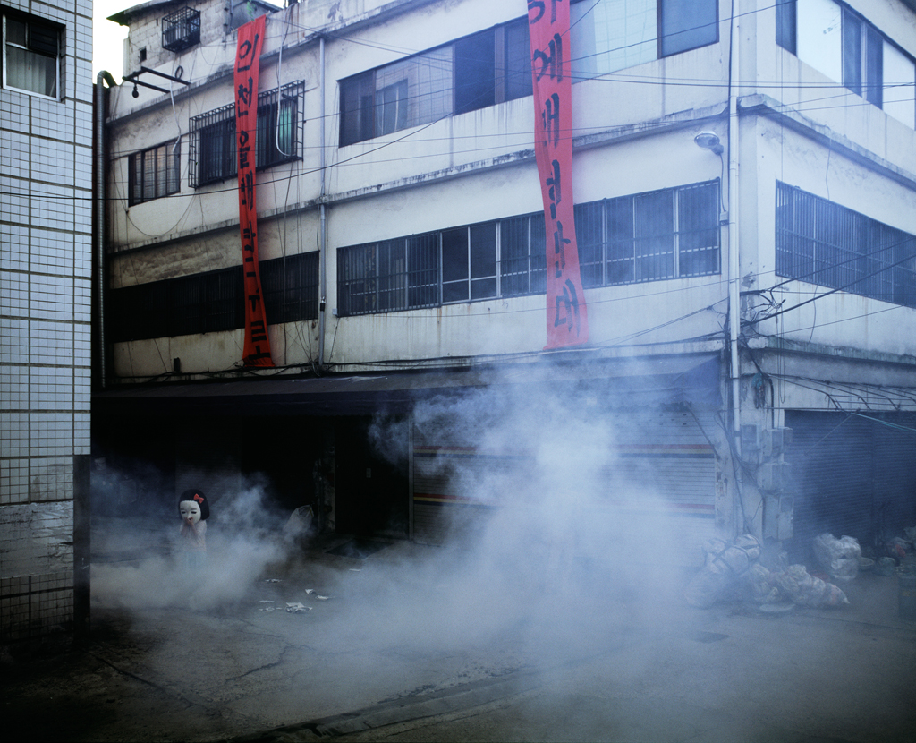 06 The Text Book (Chulsoo & Younghee) p191 (Tear Gas), 40x50 Inch Digital c-print 2007