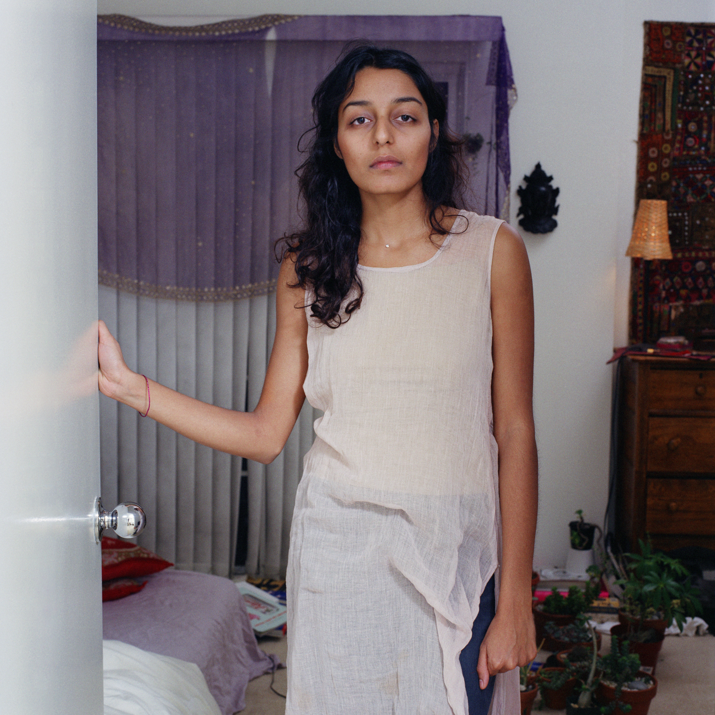 7. Ashia opening the door, C-print, 100cmx100cm, 2003